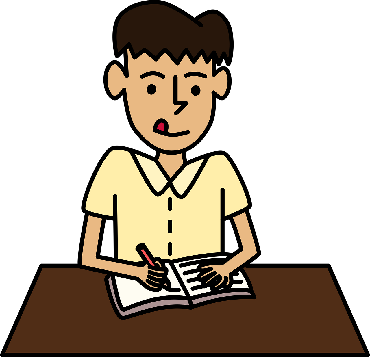 Niño sentado y escribiendo 